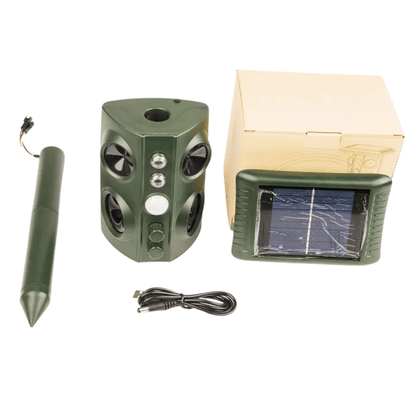 Green deer repeller device with solar panel and cable on a white background