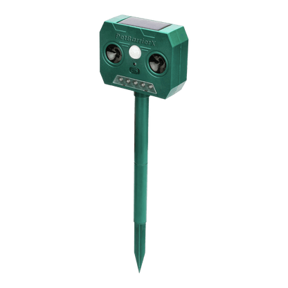 Green electronic pet sonic deterrent device on a white background