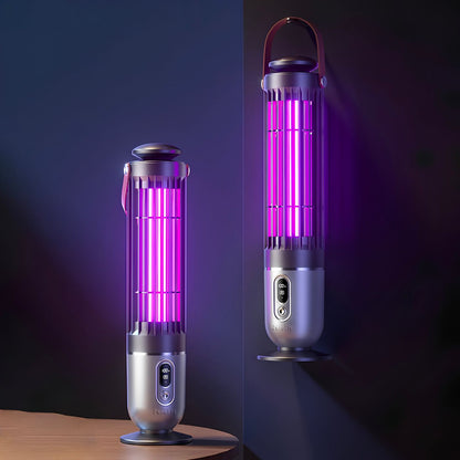 Two electric fruit fly and gnat killers, one tabletop and one wall-mounted, shown lit with a bright purple UV light. The devices have a metallic silver body with a dark gray top and a brown carrying handle.